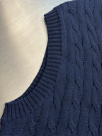 Navy sleeveless sweater vest with ribbed knit hem and cable texture