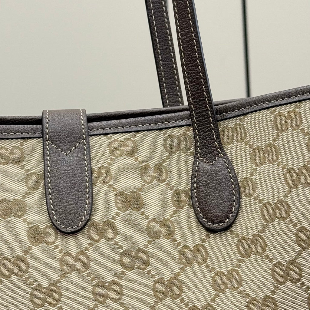 Gucci tote bag with beige GG canvas and dark leather handle straps