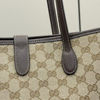 Gucci tote bag with beige GG canvas and dark leather handle straps