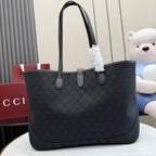 Gucci tote bag with GG monogram canvas, curved leather top handles, front zipper tab