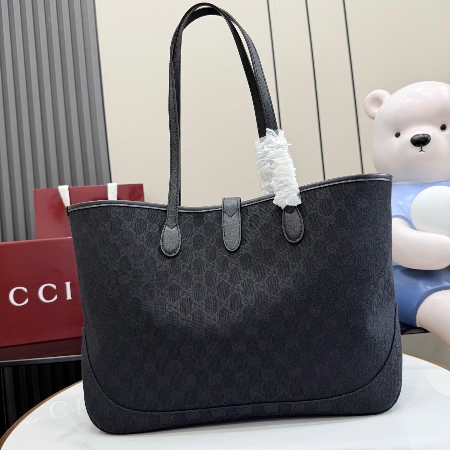 Gucci tote bag with GG monogram canvas, curved leather top handles, front zipper tab