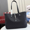 Gucci tote bag with GG monogram canvas, dark leather handles, front seam detail