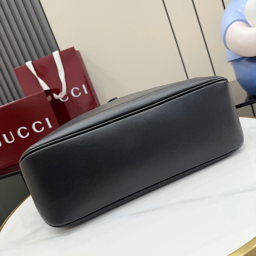 Gucci black leather tote bag bottom edge with smooth rounded base
