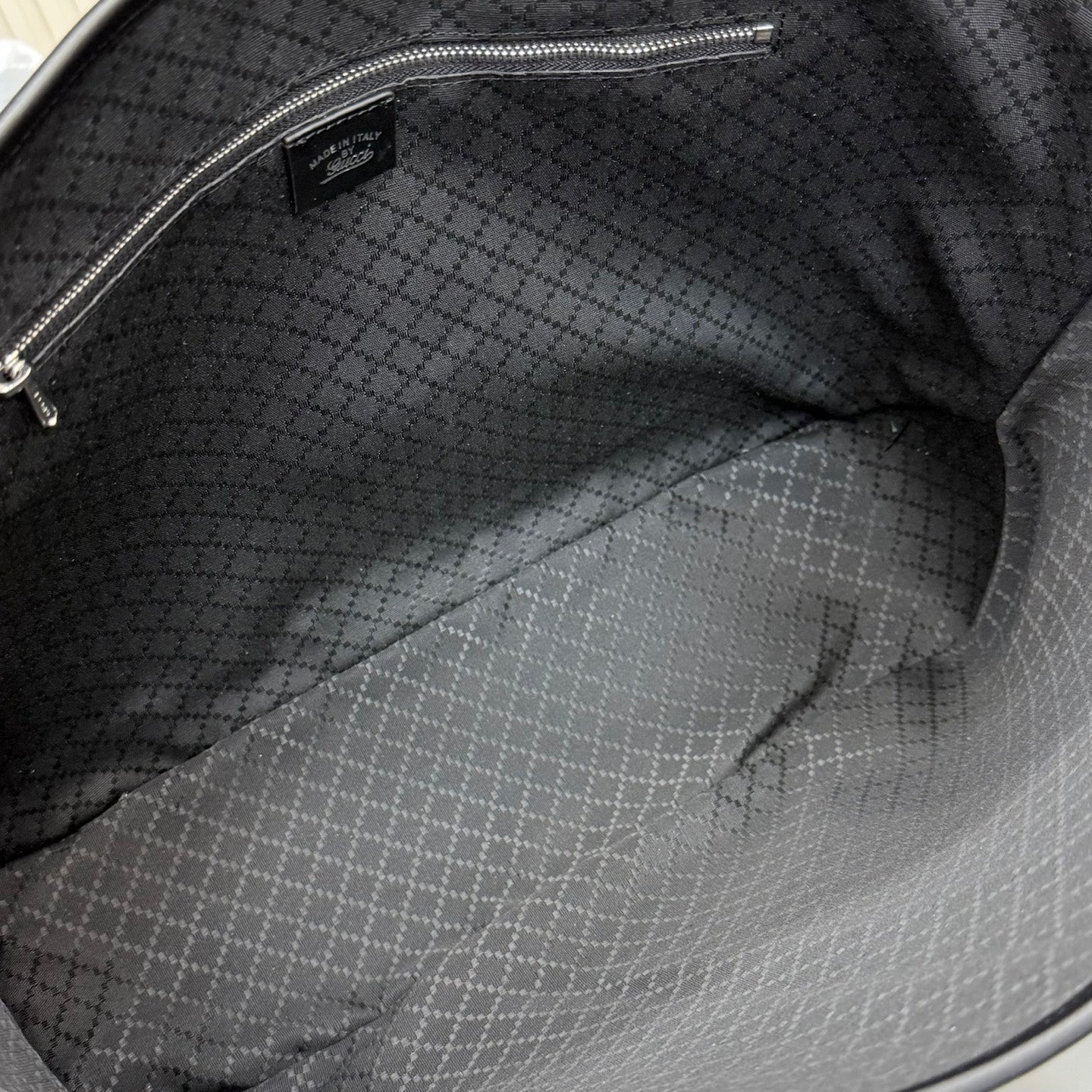 Gucci tote bag interior with dark patterned fabric lining