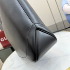 Gucci black leather tote bag corner seam and curved side panel stitching