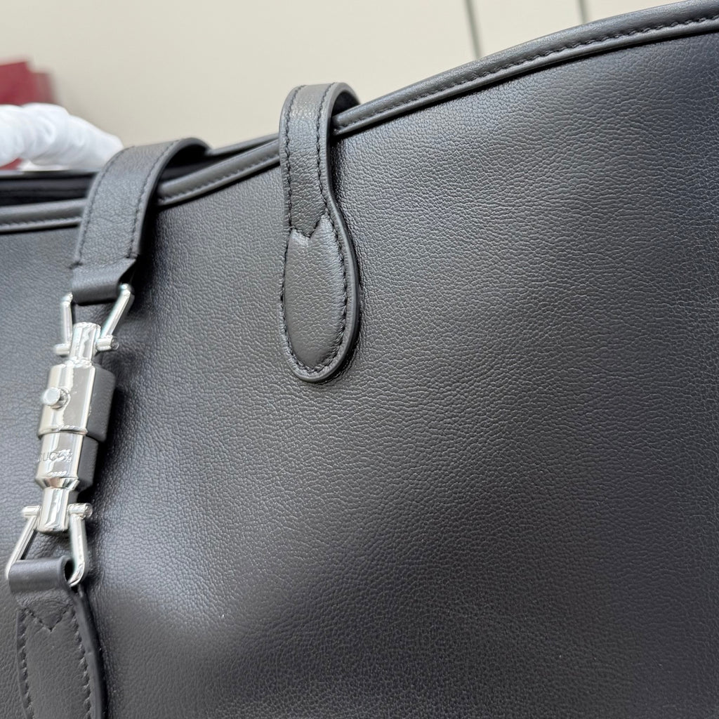 Leather shoulder bag with silver-tone hardware and top handle