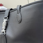 Leather shoulder bag with silver-tone hardware and top handle