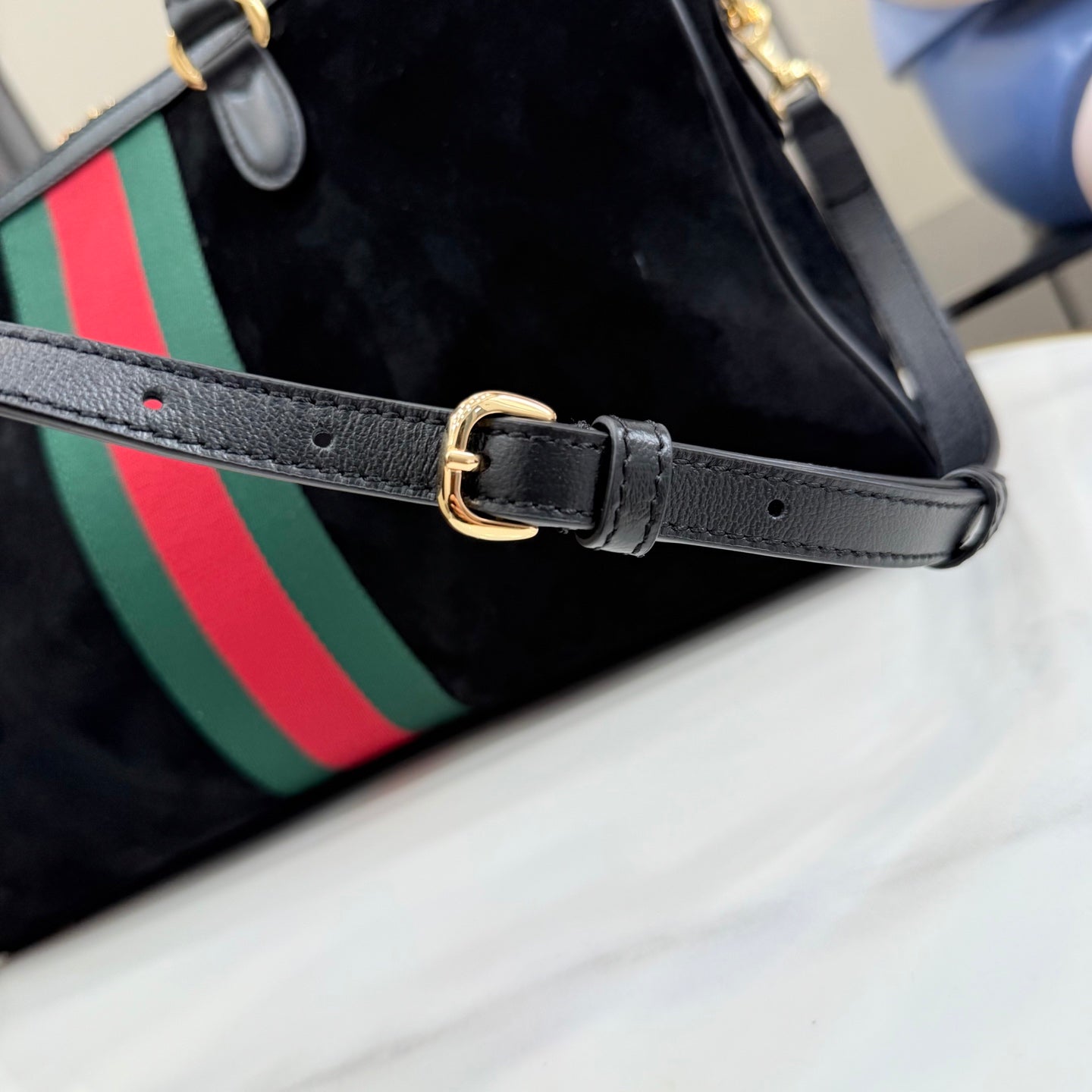 Gucci bag strap with gold buckle, dark gray leather and perforations