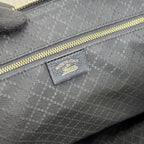 Gucci bag interior label on gray jacquard lining under gold zipper