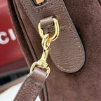Gucci handbag crossbody strap with gold-tone clasp and dark brown leather panel