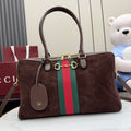 Gucci handbag in dark brown suede with green and red web stripe and top handles