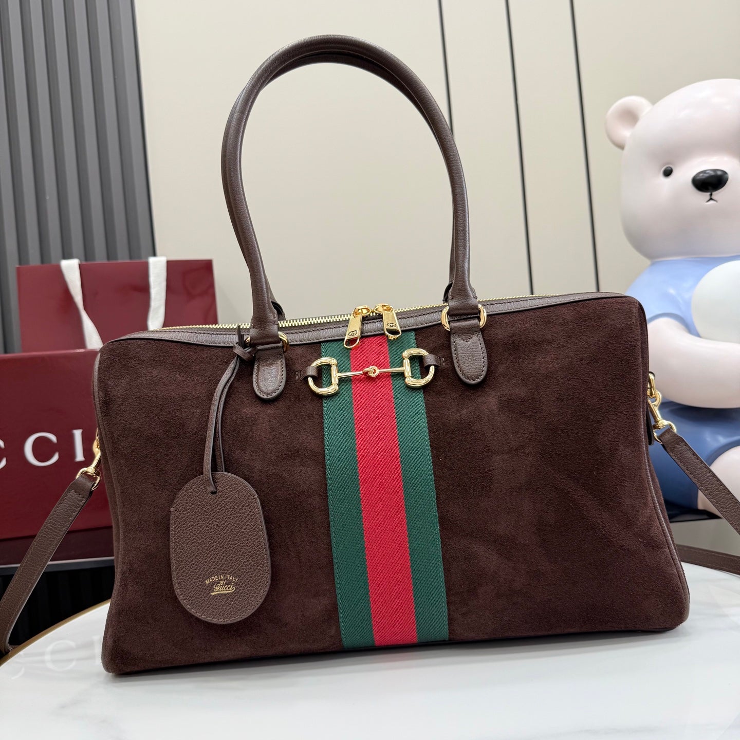 Gucci handbag in dark brown suede with green and red web stripe and top handles