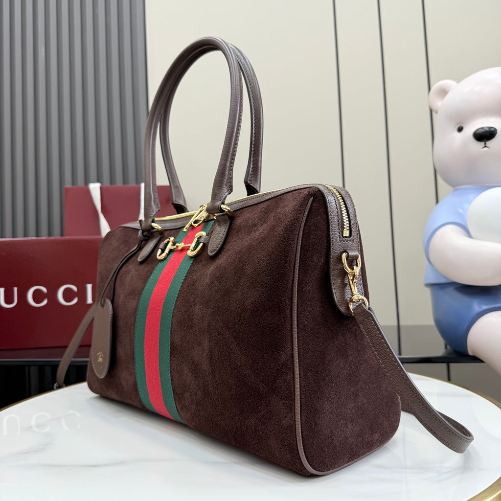 Gucci handbag on dark brown suede with green and red web stripe and side profile seam