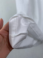 White T-shirt cuff and inner seam detail
