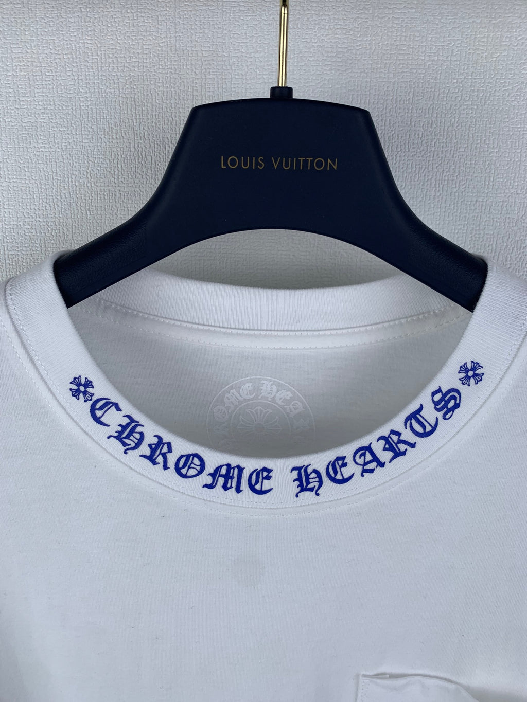 White T-shirt with blue printed collar trim and Louis Vuitton neck logo