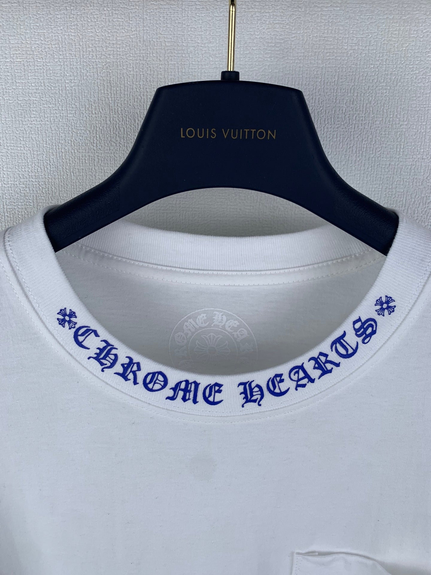 White T-shirt with blue printed collar trim and Louis Vuitton neck logo