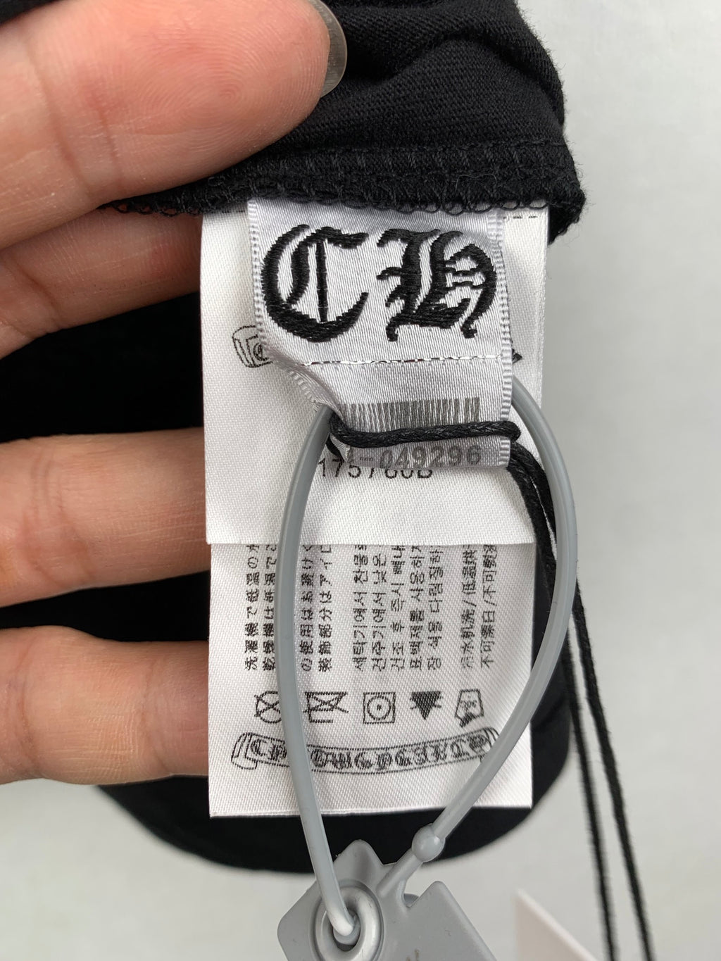 Louis Vuitton black T-shirt neck tag with size label and care symbols