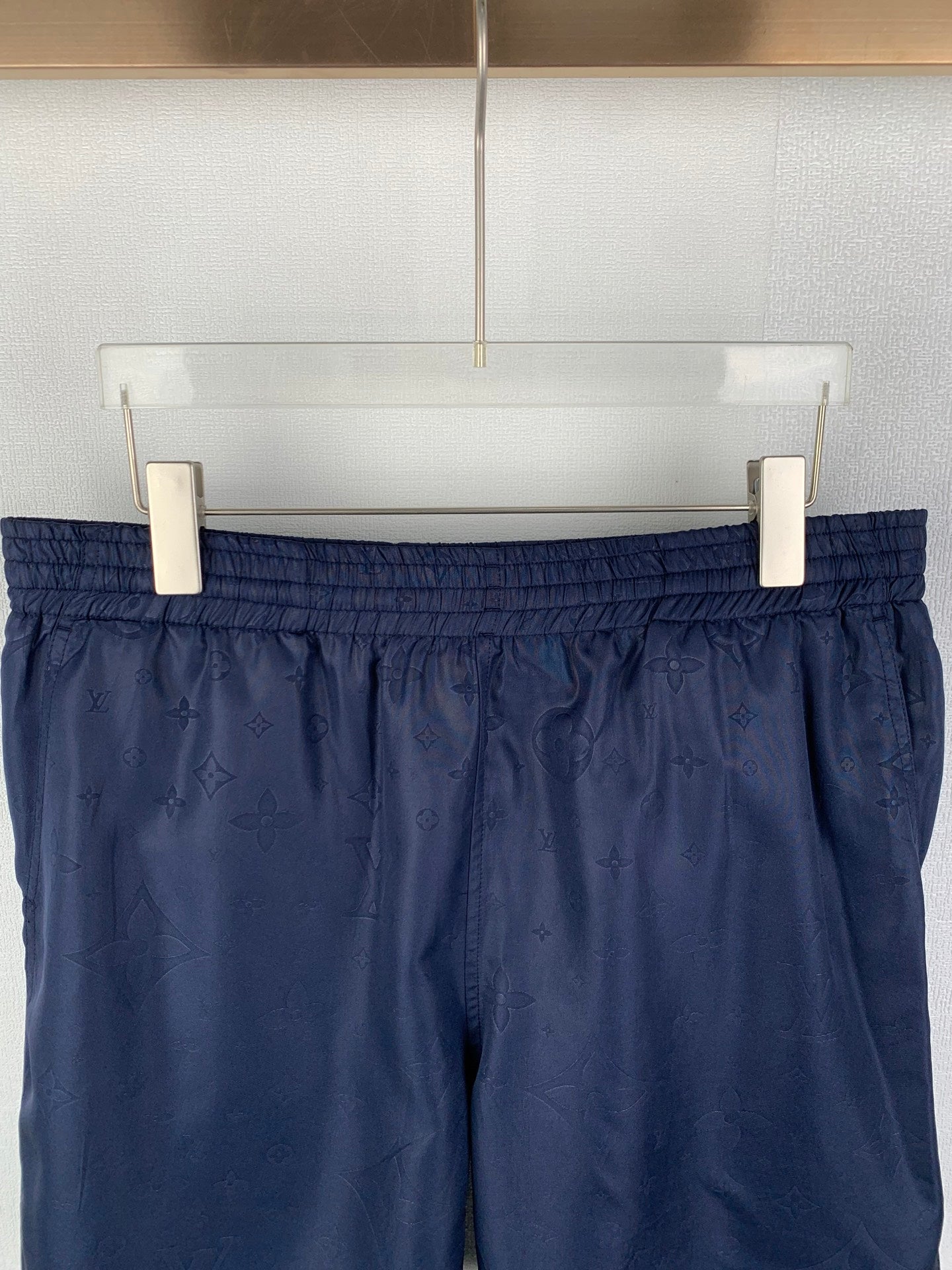 Louis Vuitton monogram shorts front view with elastic waistband, dark navy
