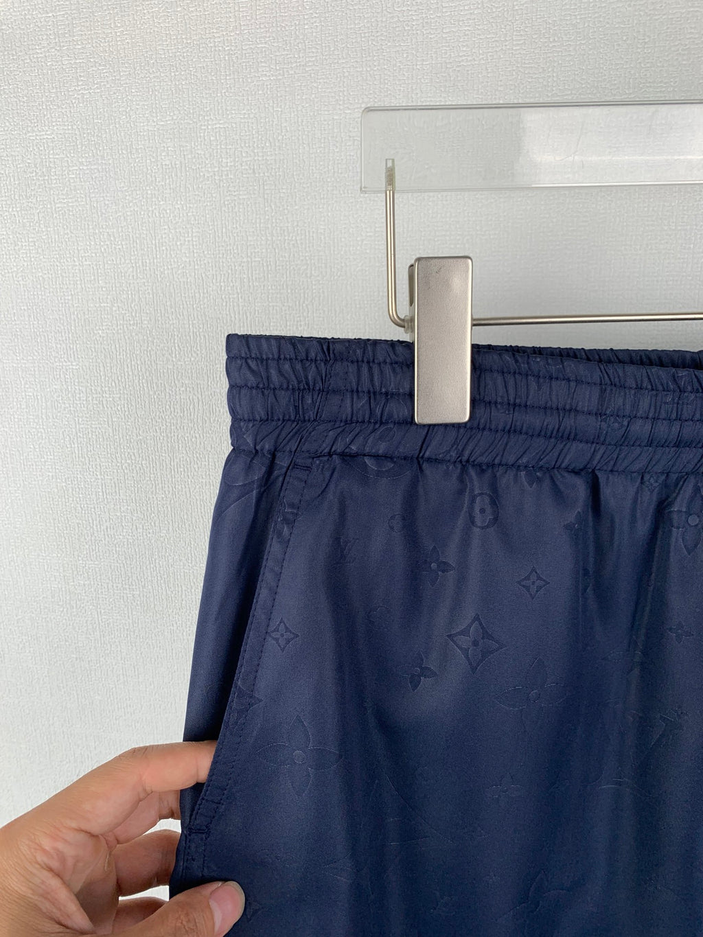 Louis Vuitton monogram shorts on hanger with elastic waistband, dark navy