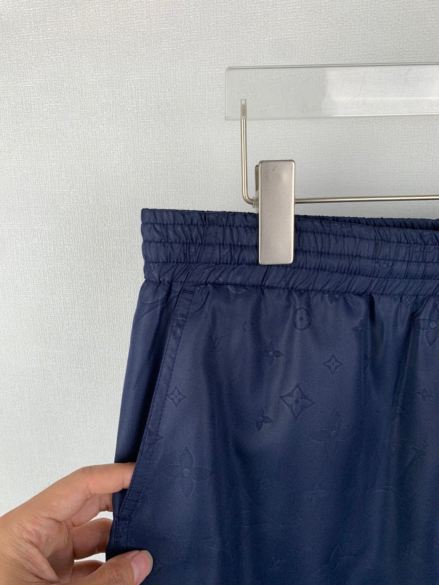 Louis Vuitton monogram shorts on hanger with elastic waistband, dark navy