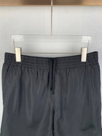 Louis Vuitton black shorts front view, elastic waist with drawstring