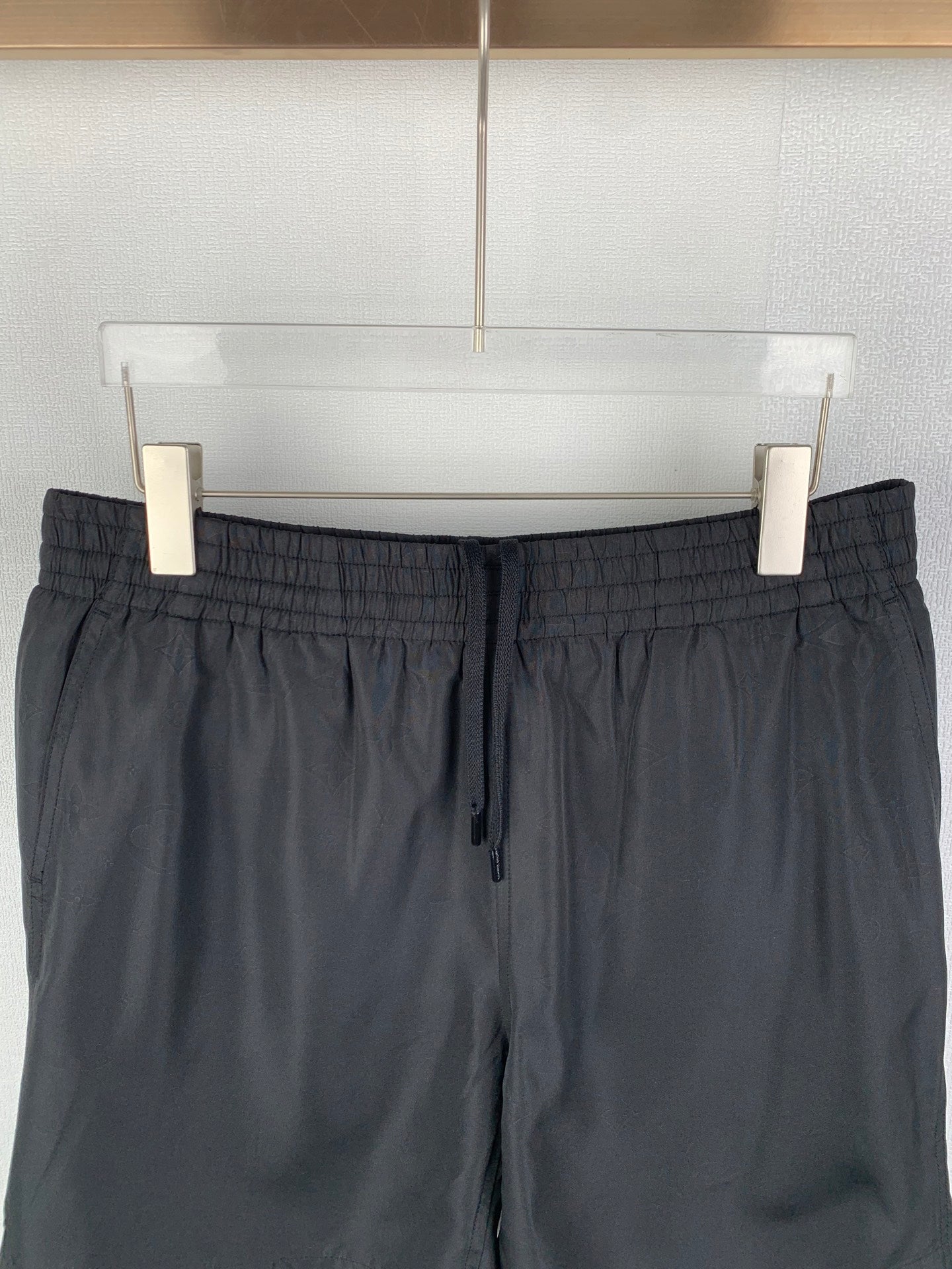 Louis Vuitton black shorts front view, elastic waist with drawstring