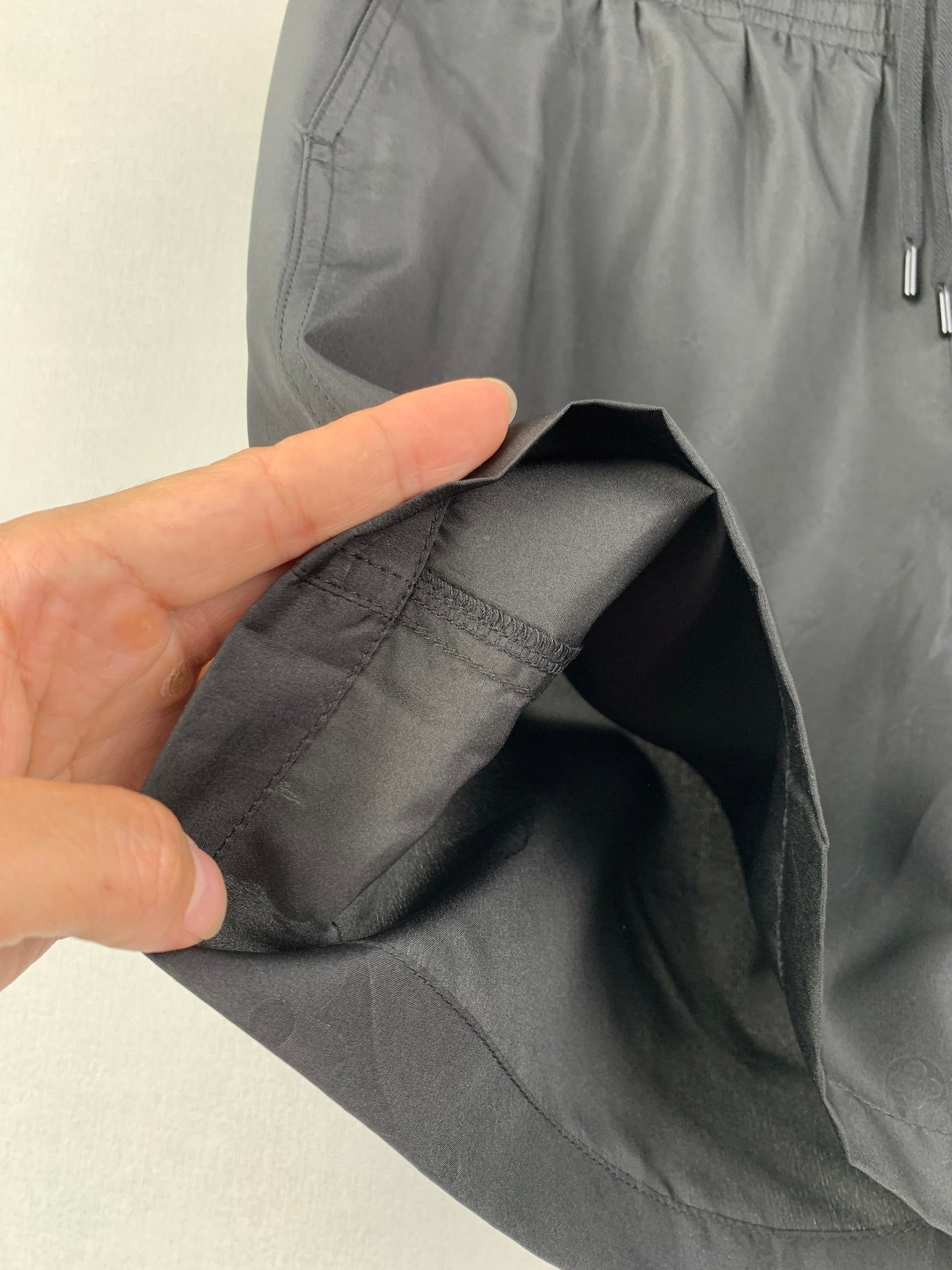 Louis Vuitton black shorts inner pocket and fabric lining seam