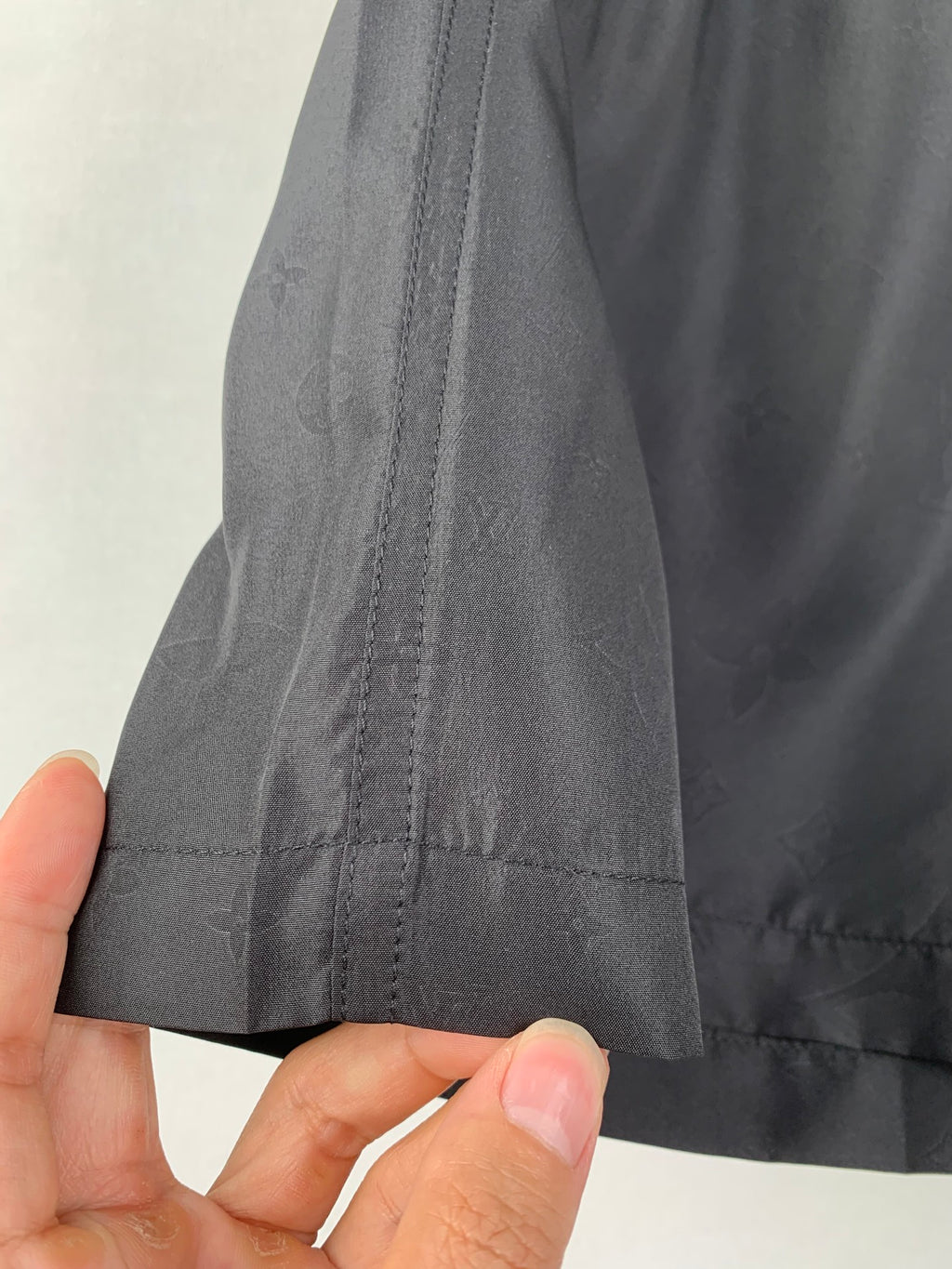 Louis Vuitton black shorts side seam and hem with visible stitching detail
