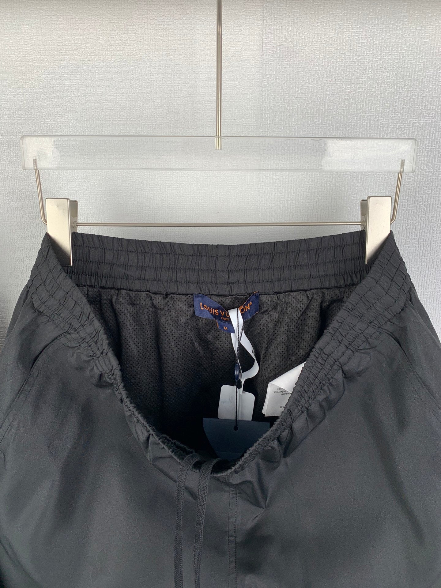 Louis Vuitton black shorts interior view with drawstring and mesh lining