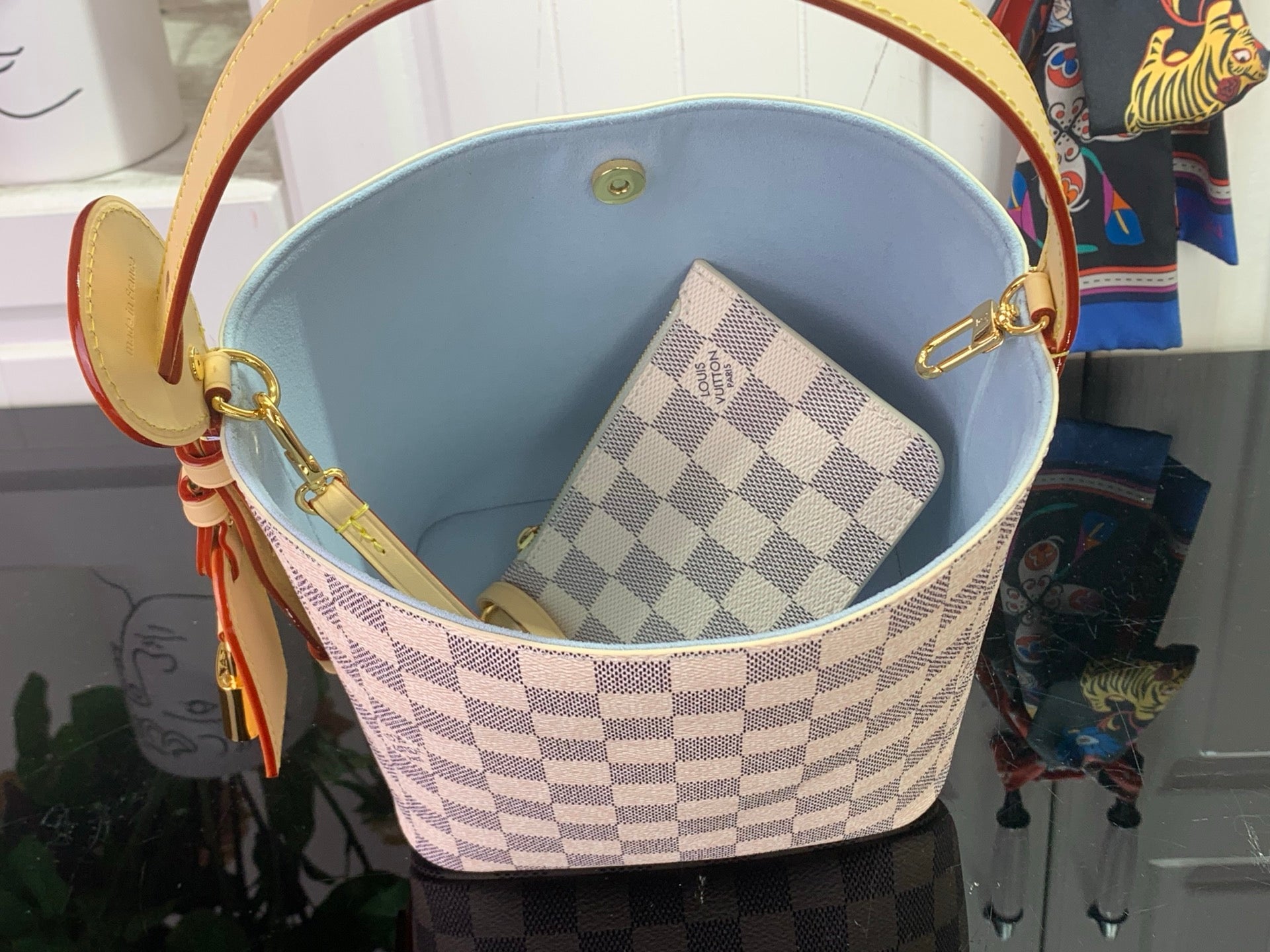 Louis Vuitton Damier checkered bag with light blue interior lining and leather trim