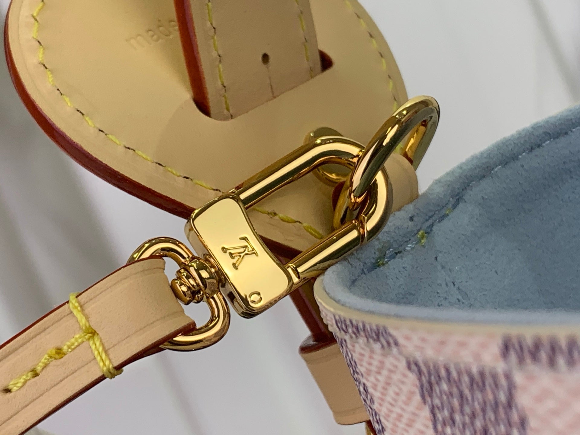 Louis Vuitton bag clasp and leather strap with gold-tone hardware