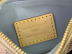 Louis Vuitton Paris leather patch with yellow stitching on blue fabric, gold lettering