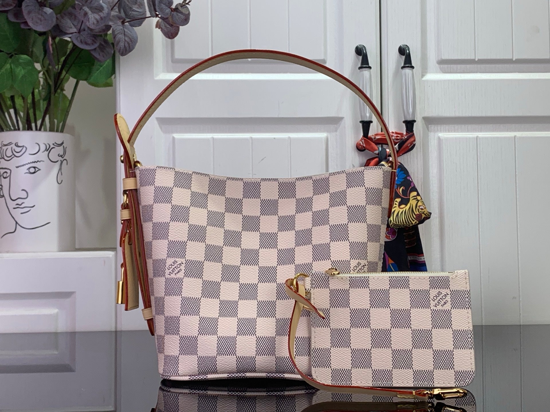 Louis Vuitton Damier checkered tote with top handle and front pouch, side view
