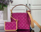 Purple monogram tote bag with tan leather handles and crossbody strap