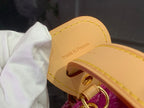 Tan leather ring and clasp on purple monogram bag, made in France