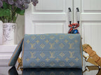 Louis Vuitton monogram bag with flap design, blue with tan strap and gold hardware