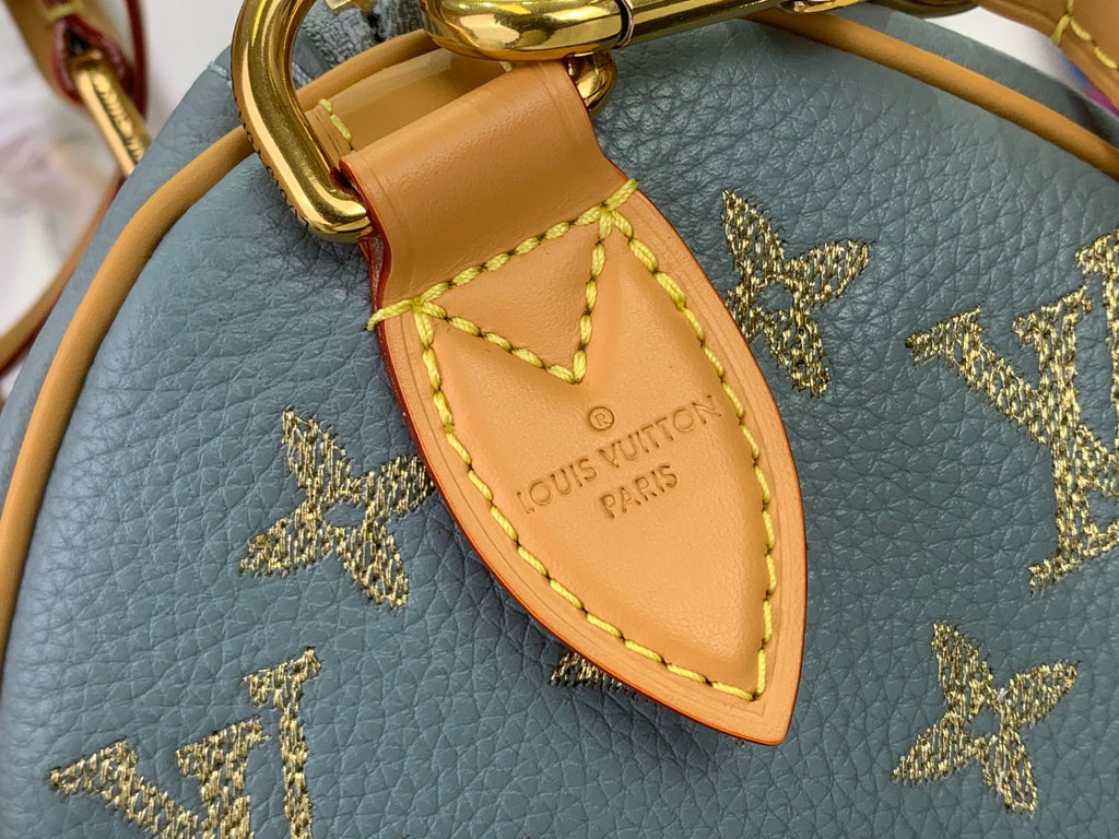 Louis Vuitton monogram bag key fob charm on blue leather with gold stars