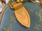 Louis Vuitton monogram bag key fob charm on blue leather with gold stars