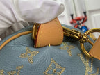 Louis Vuitton monogram bag corner with tan charm and gold star pattern
