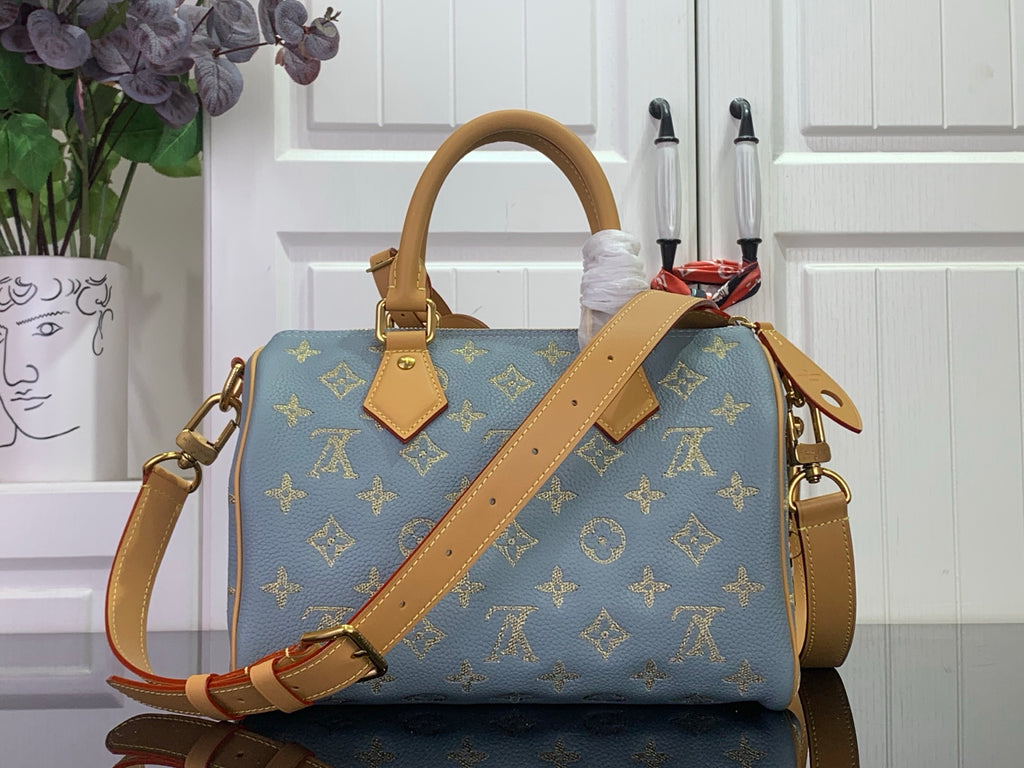 Louis Vuitton monogram bag, blue with tan leather crossbody strap and top handle