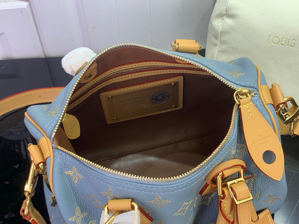 Louis Vuitton monogram bag, light blue leather, top zipper, gold hardware