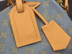Louis Vuitton monogram bag charm and luggage tag set on blue leather