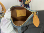Louis Vuitton monogram bag interior with gold zipper and brown lining