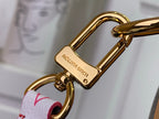 Louis Vuitton metal key hook and clasp attached to the bag strap