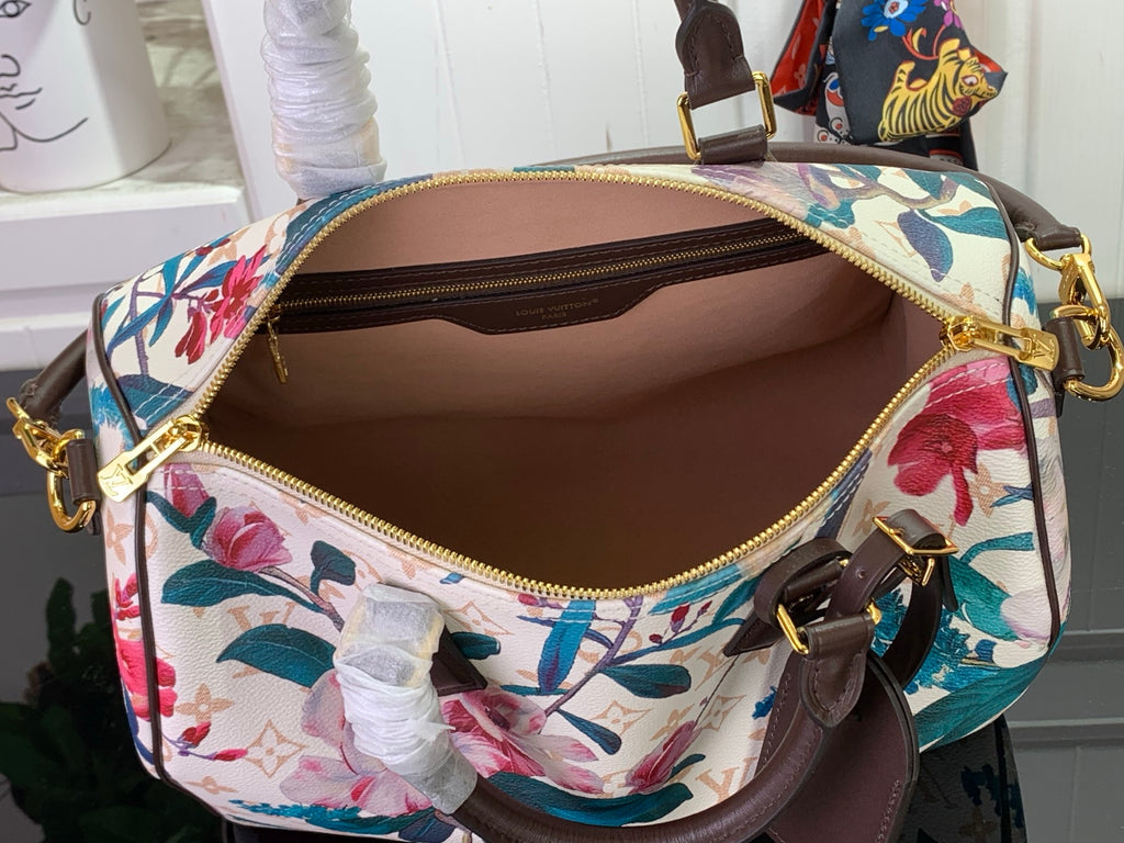 Louis Vuitton bag with floral print, open top, brown interior, gold zippers