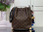 Louis Vuitton monogram bag with black crossbody strap, dark brown back view
