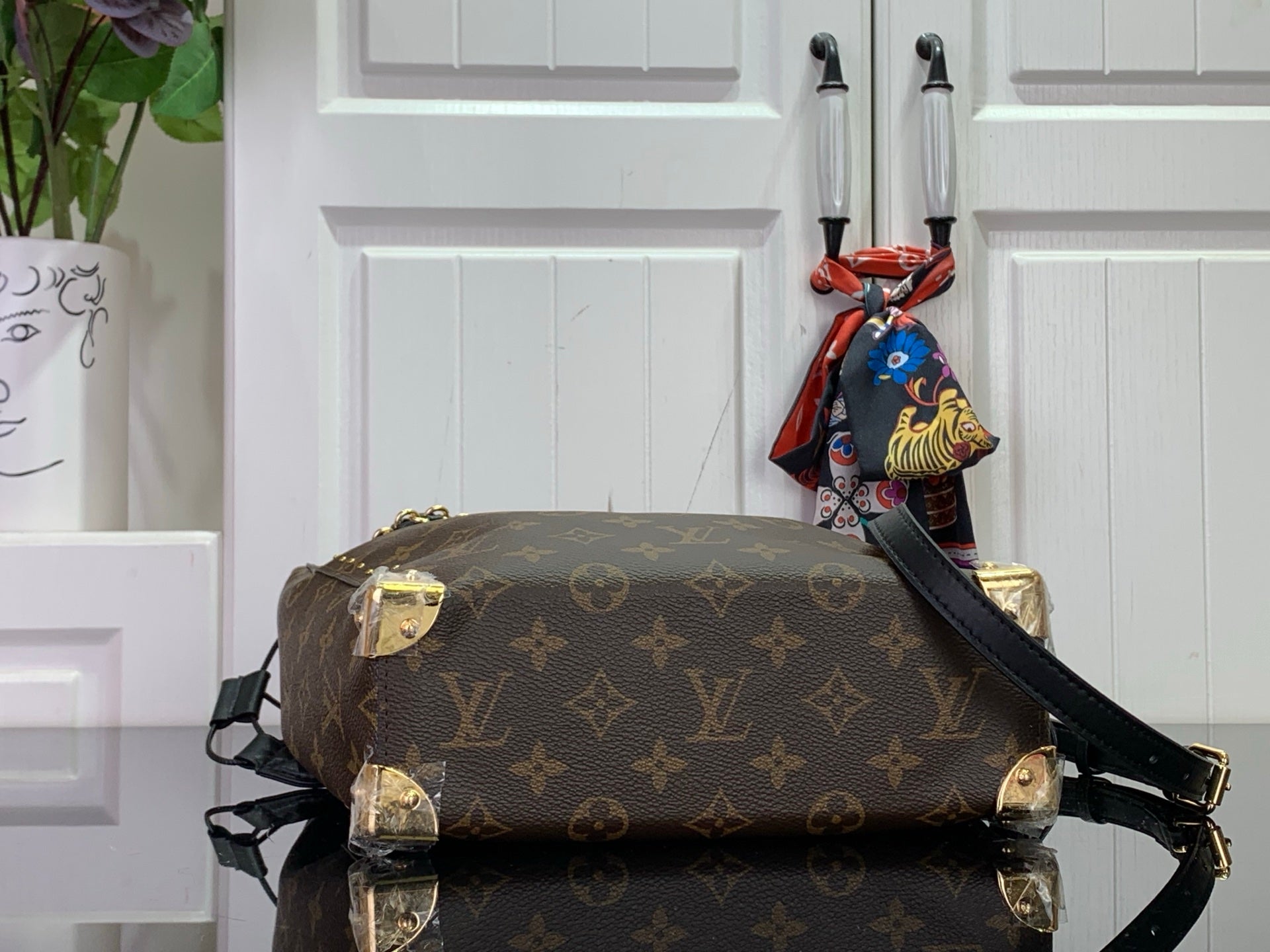 Louis Vuitton monogram duffel bag with shoulder strap, brown canvas and gold details