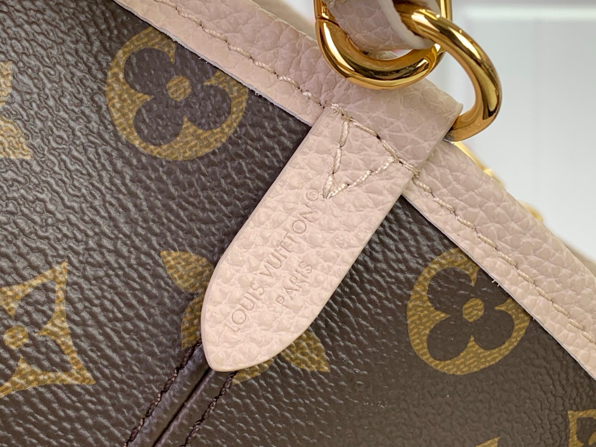 Louis Vuitton monogram tote bag strap and leather tab with gold-toned clasp