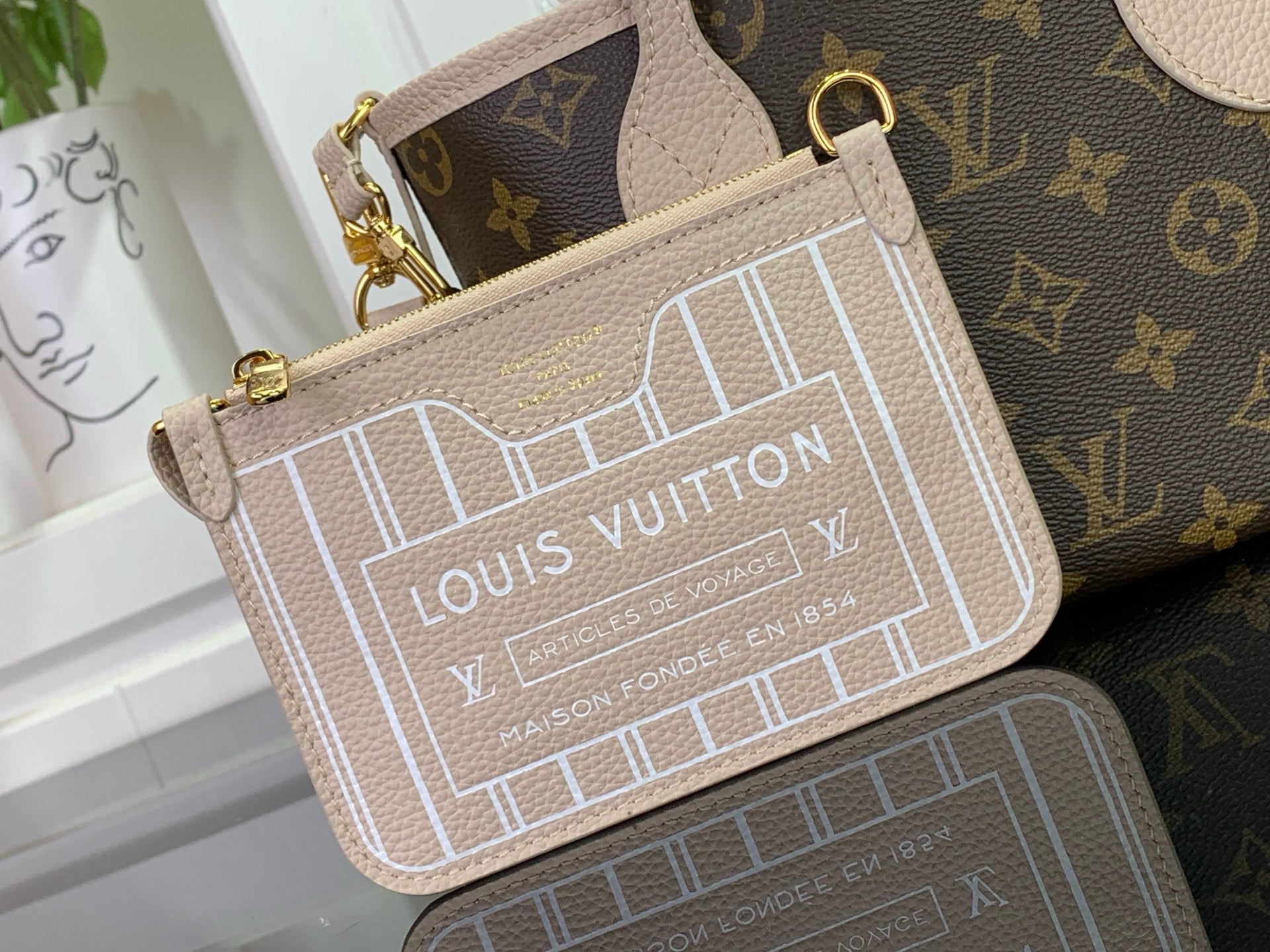 Louis Vuitton monogram small crossbody pouch in beige with gold-tone clasp and strap