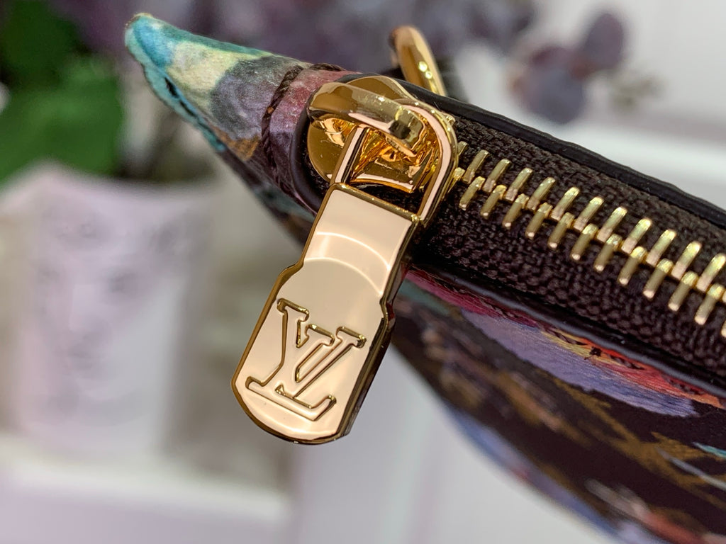 Gold-tone zipper pull with Louis Vuitton lock on floral monogram pouch